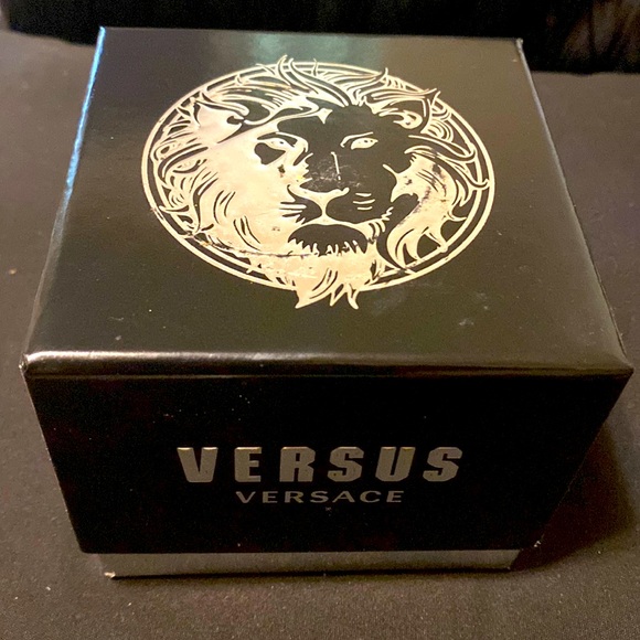 Versus Versace watch with green background gold and silver